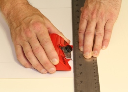 Line up your mat cutter with the straight edge
